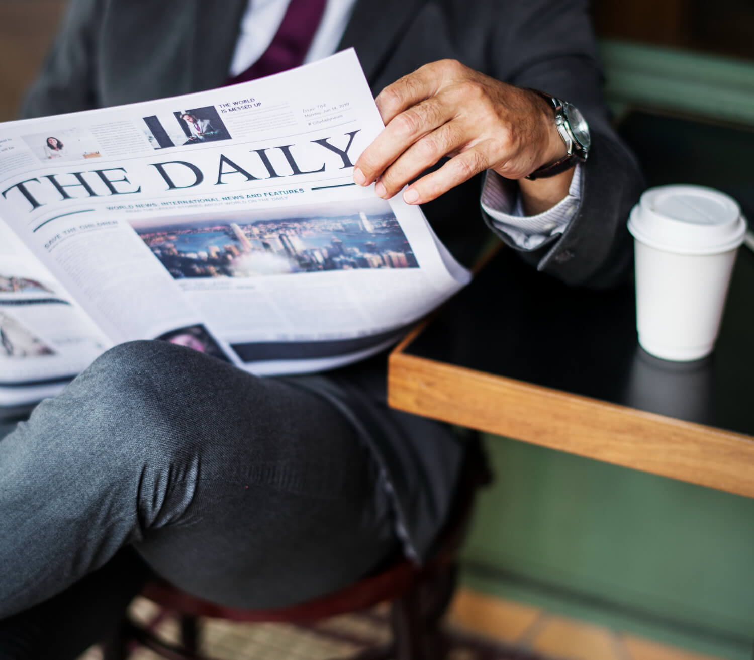 businessman reading daily news about Us Stocks