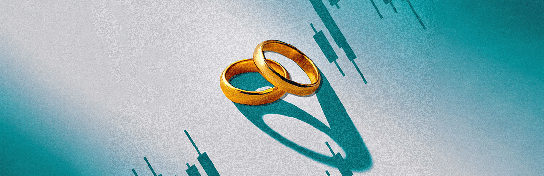 Two gold wedding rings casting shadows on a background of stock market candlestick charts, symbolizing marrying your positions in trading.